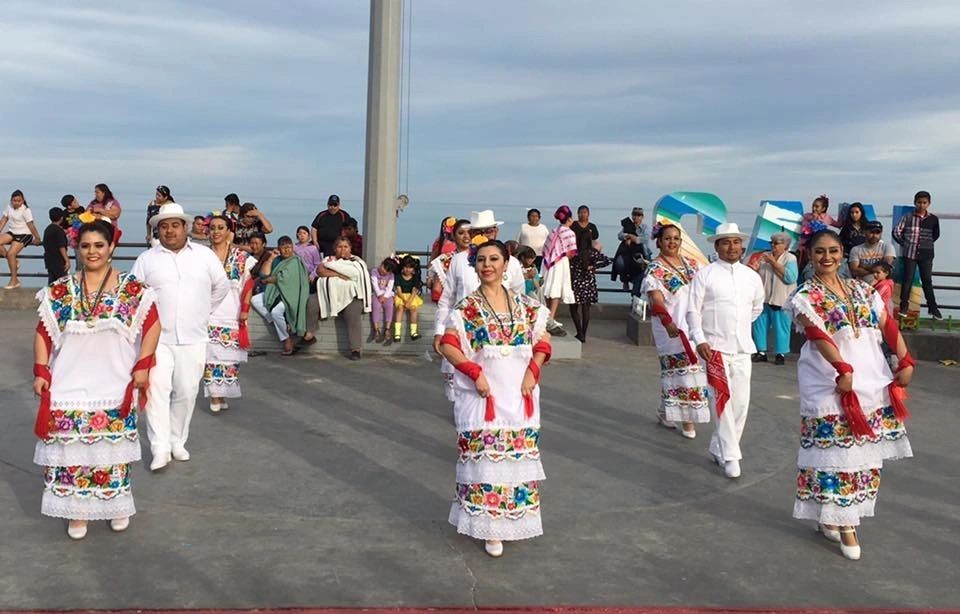 A group of people in traditional mexican clothing.